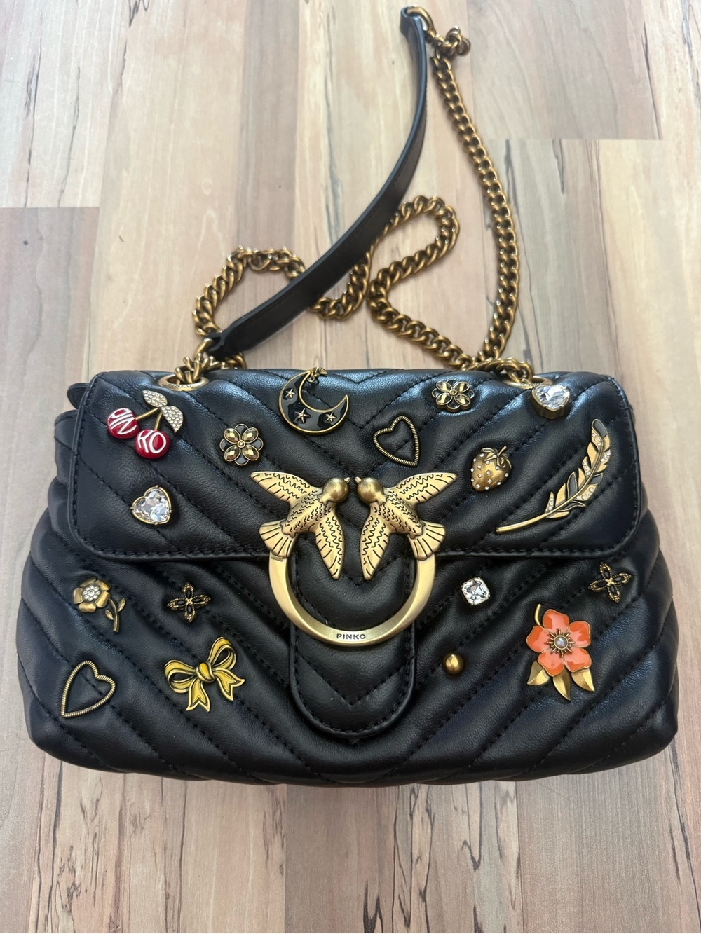 Pinko Black Quilted Shoulder Bag with Gold Hardware and Decorative Pins